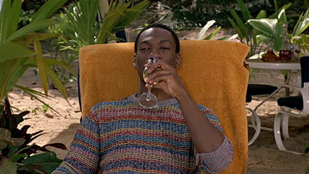 The actor, Eddie Murphy, relaxing on a beach.