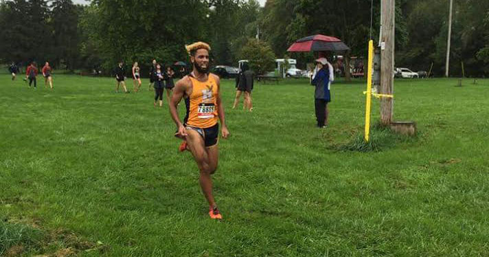 Jake Thomson finishing a race on grass