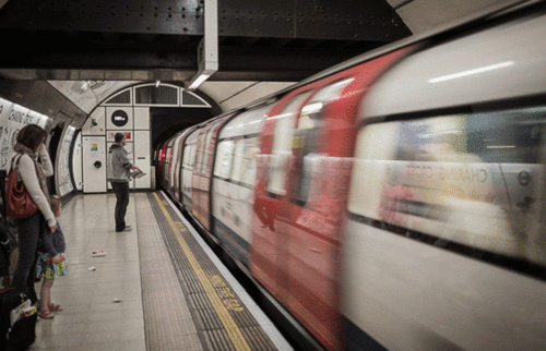 Subway train going by a platform