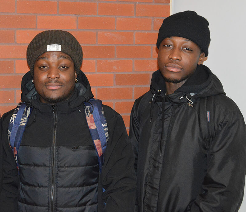 Two male students side to side
