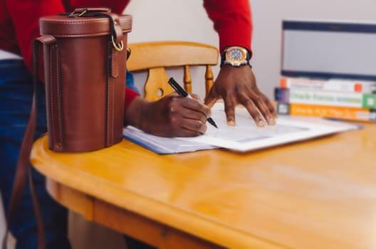 Man signing papers