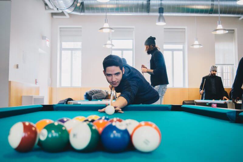 Allan Ruiz lining up to break during a game of pool