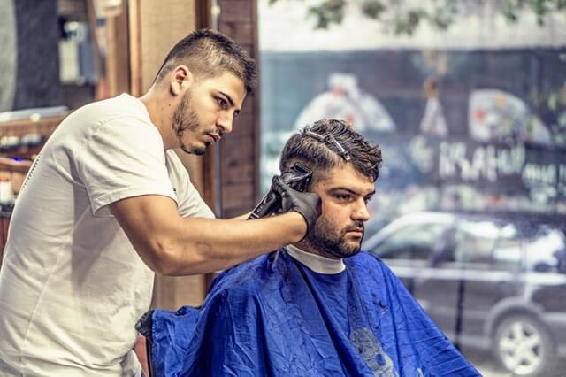 Guy getting hair cut