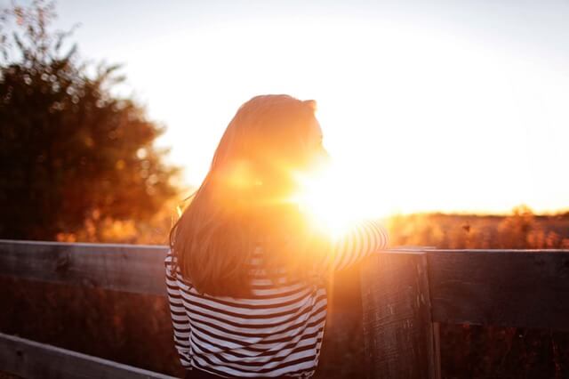 Girl looking at sunset