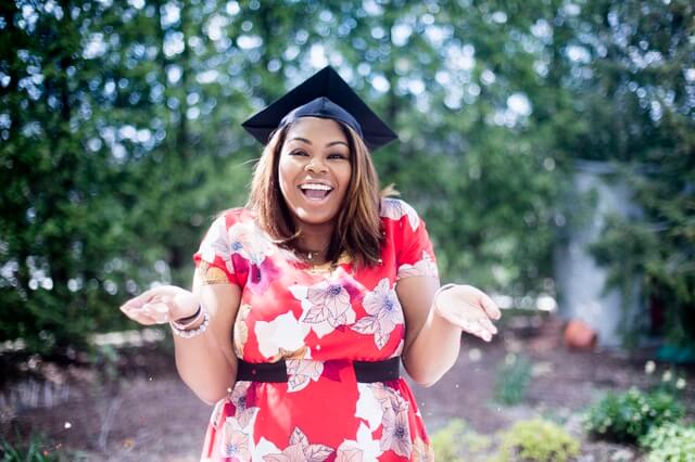 Girl wearing dress and graduation cap