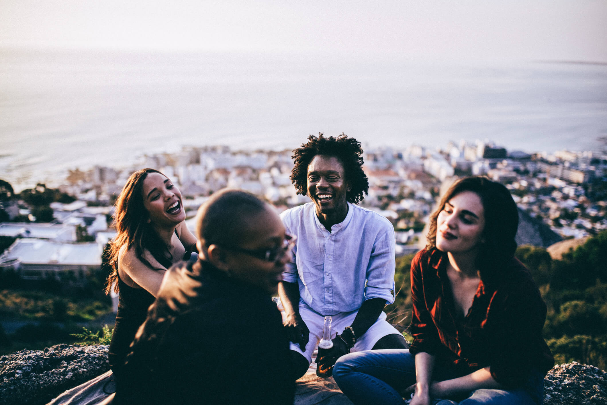A happy group of 4 people sitting together