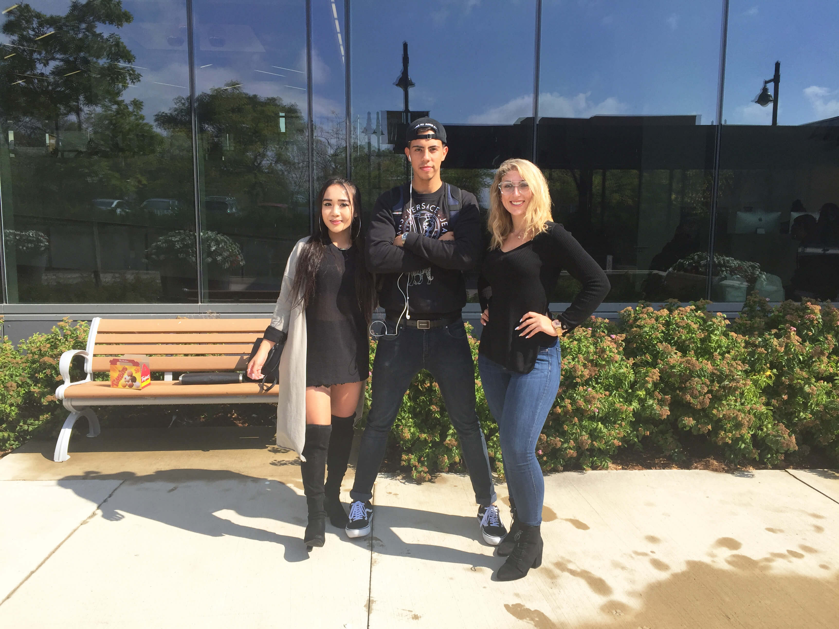 Three Humber College students standing and smiling posing for a photo