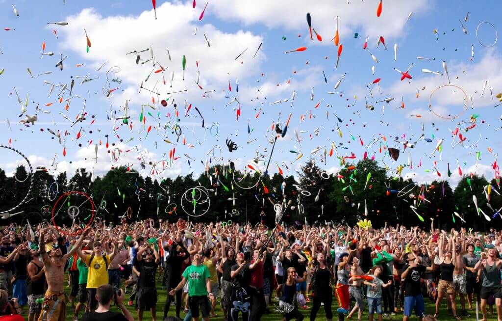 A large crowd of jugglers outdoors
