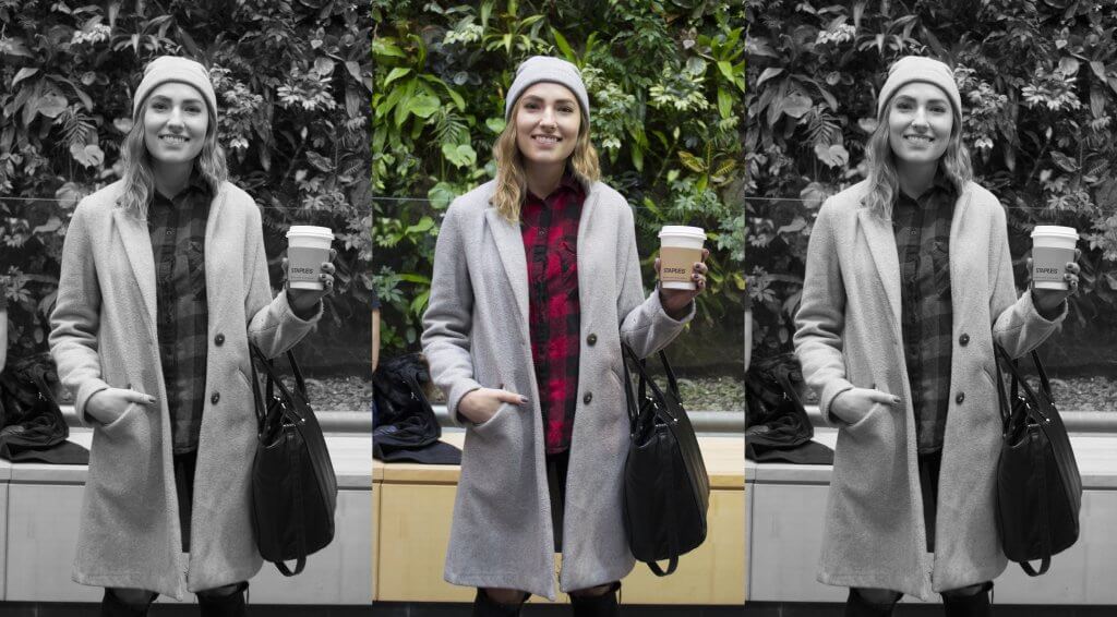 Guelph-Humber student Katherine posing in front of the plant wall with a cup of tea