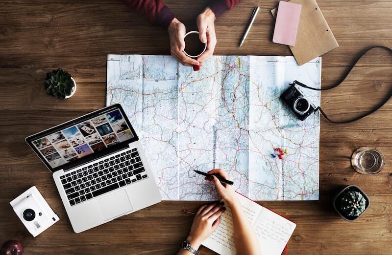 Photo of a map and a laptop