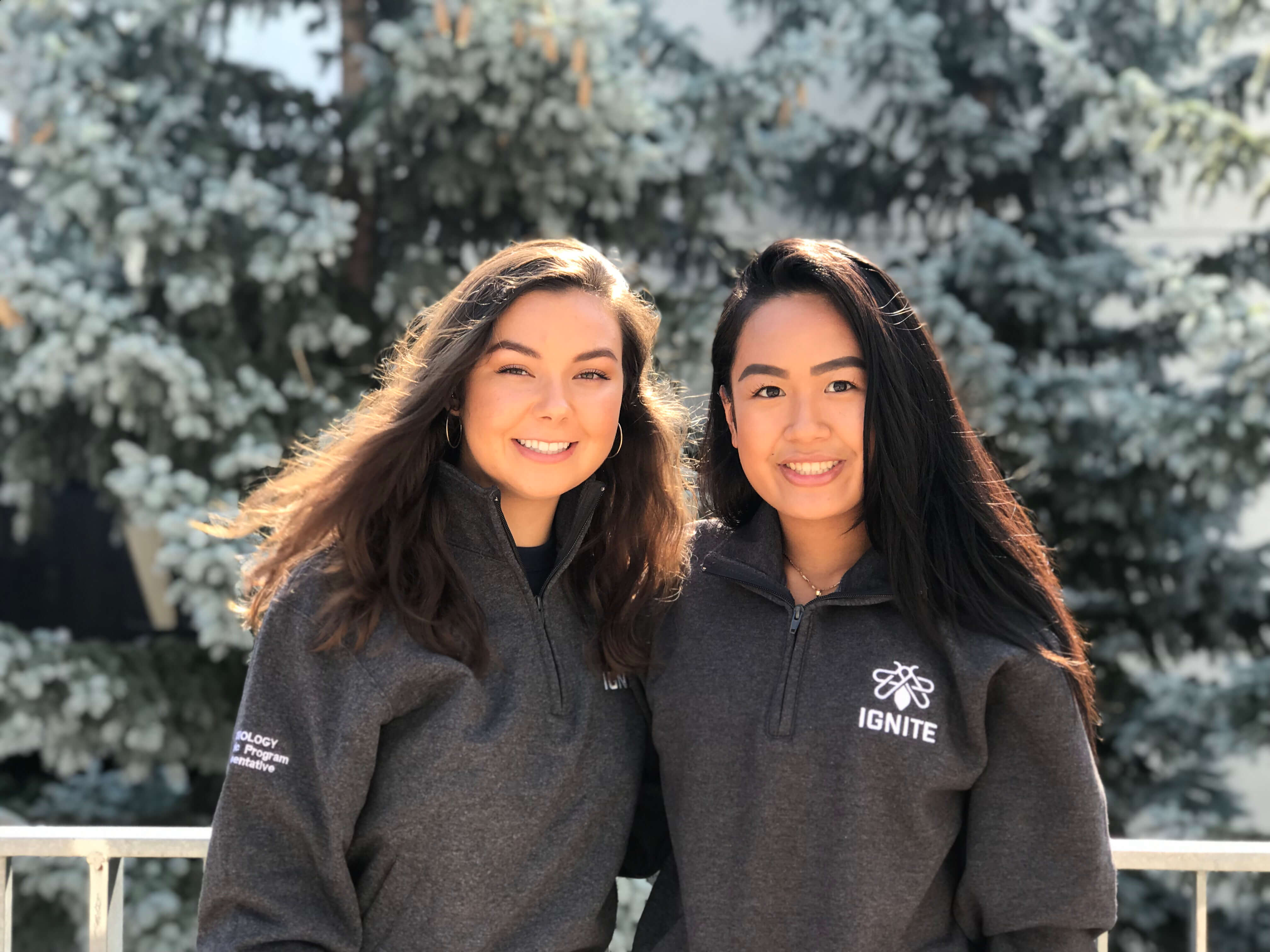 Two girls standing side by side