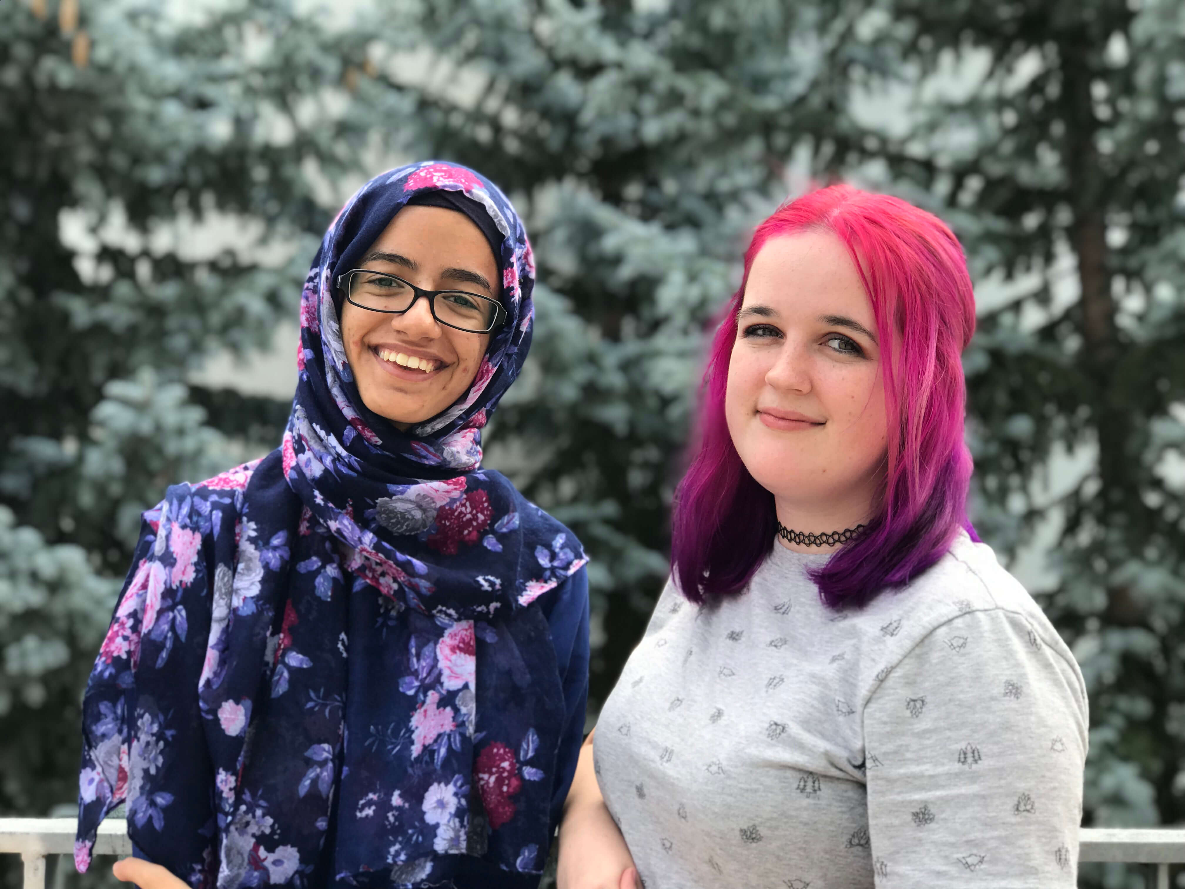 two girls standing side by side