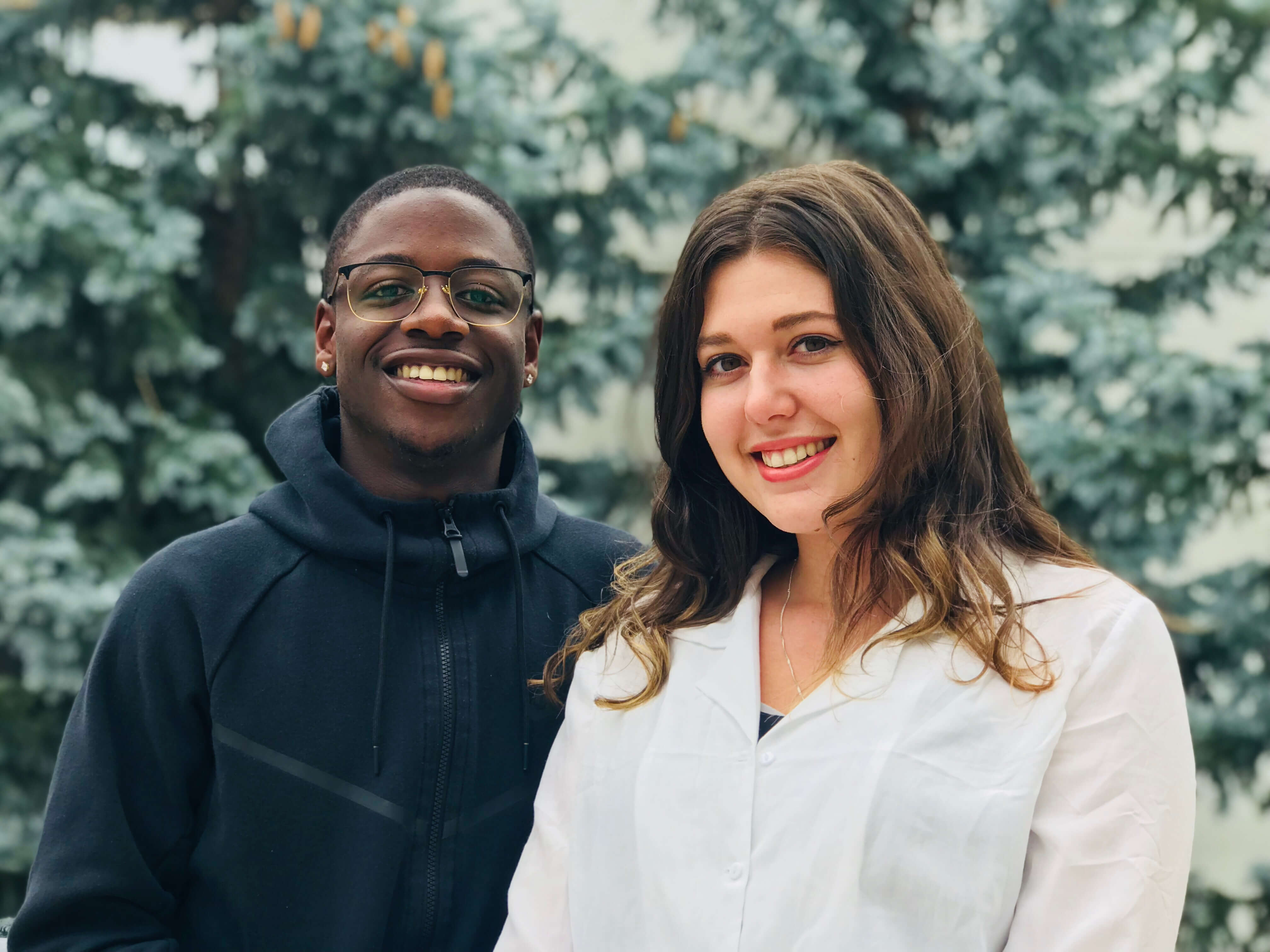 boy and girl standing next to each other