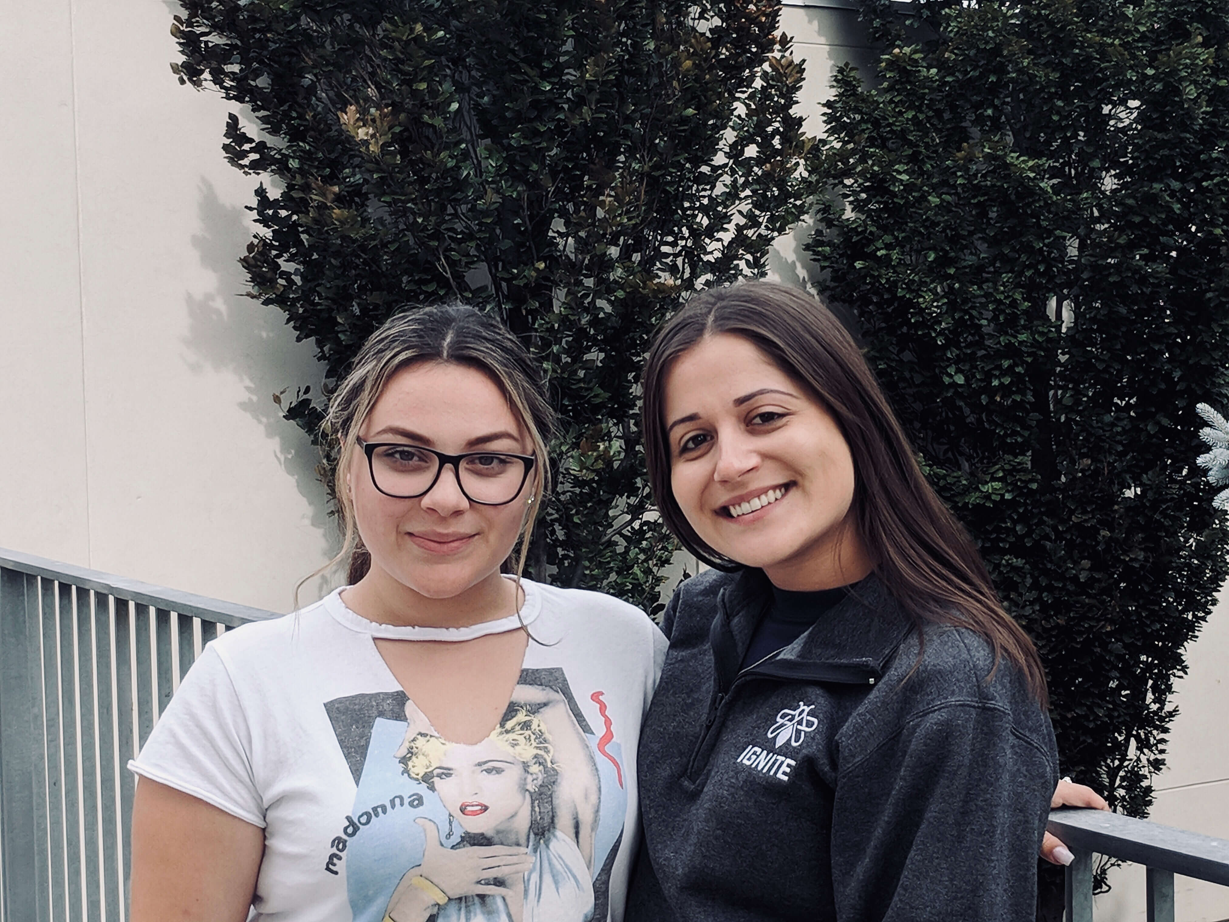two girls standing side by side