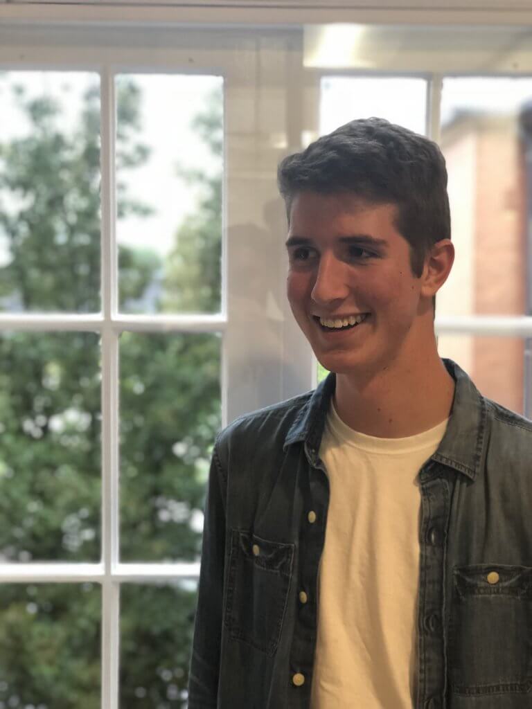 Humber student, Gavin Hinton, poses for photo by a window.