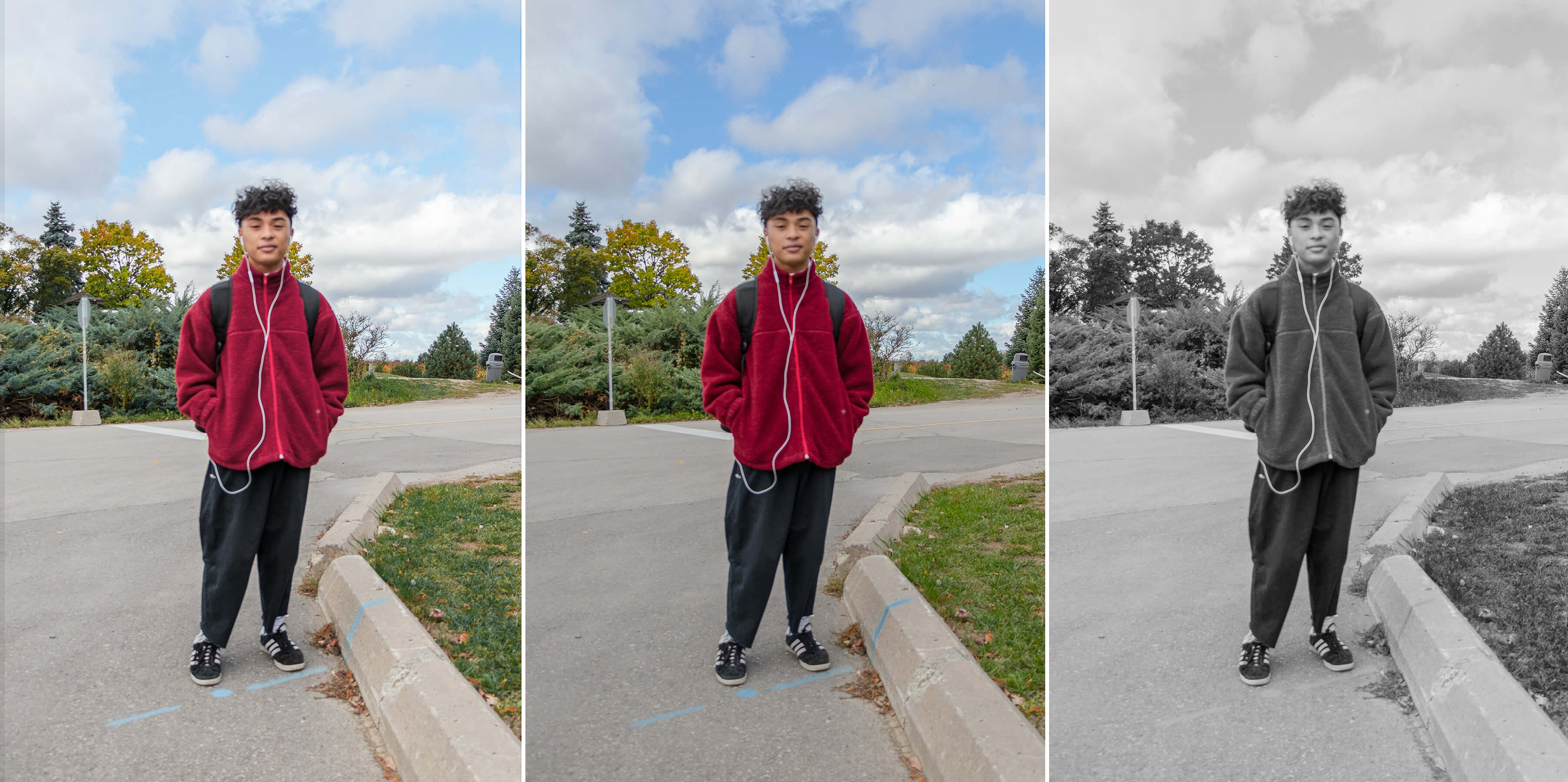 Student in bright jacket poses in the park