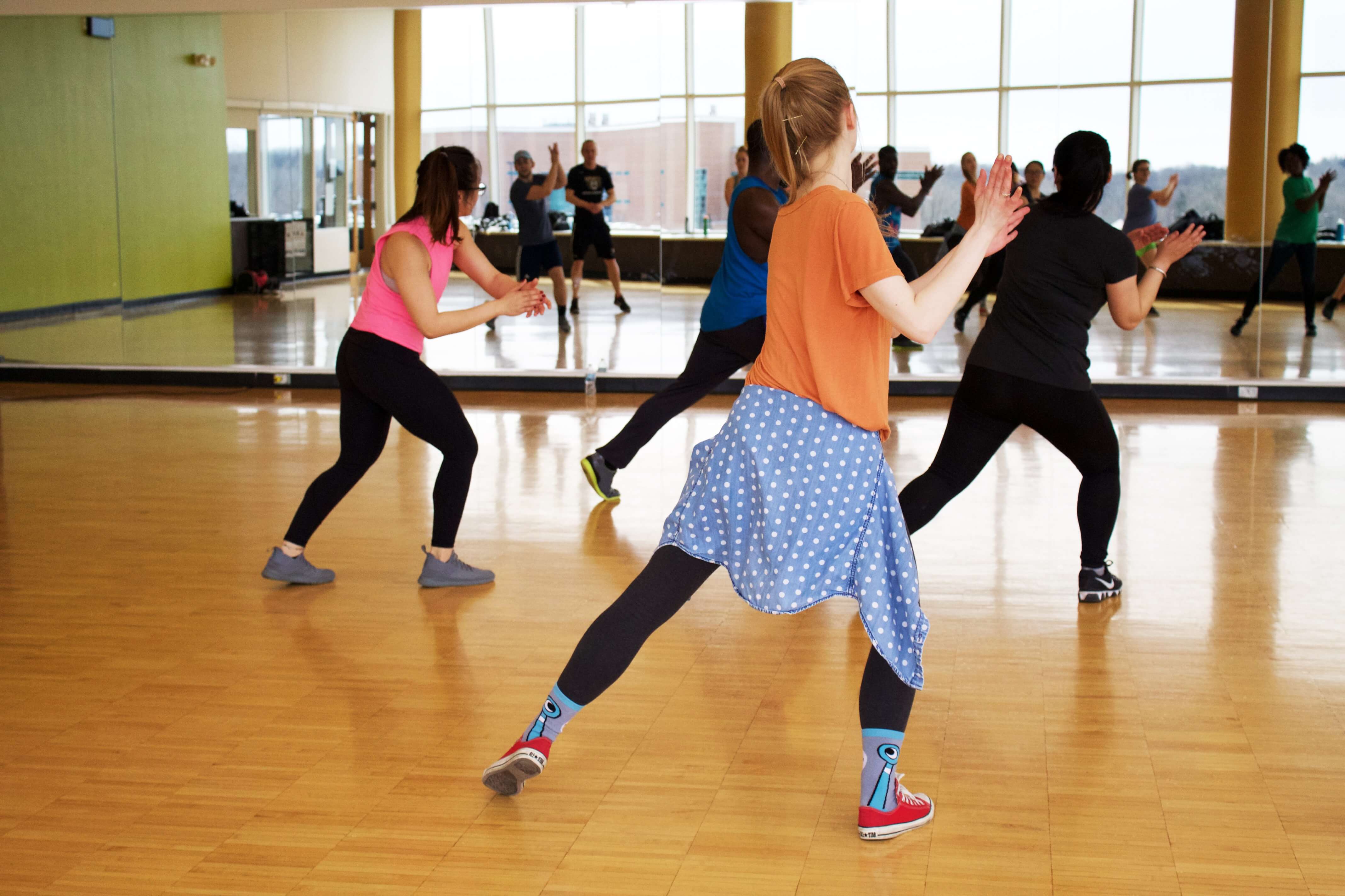 Women dancing in a Zumba class.