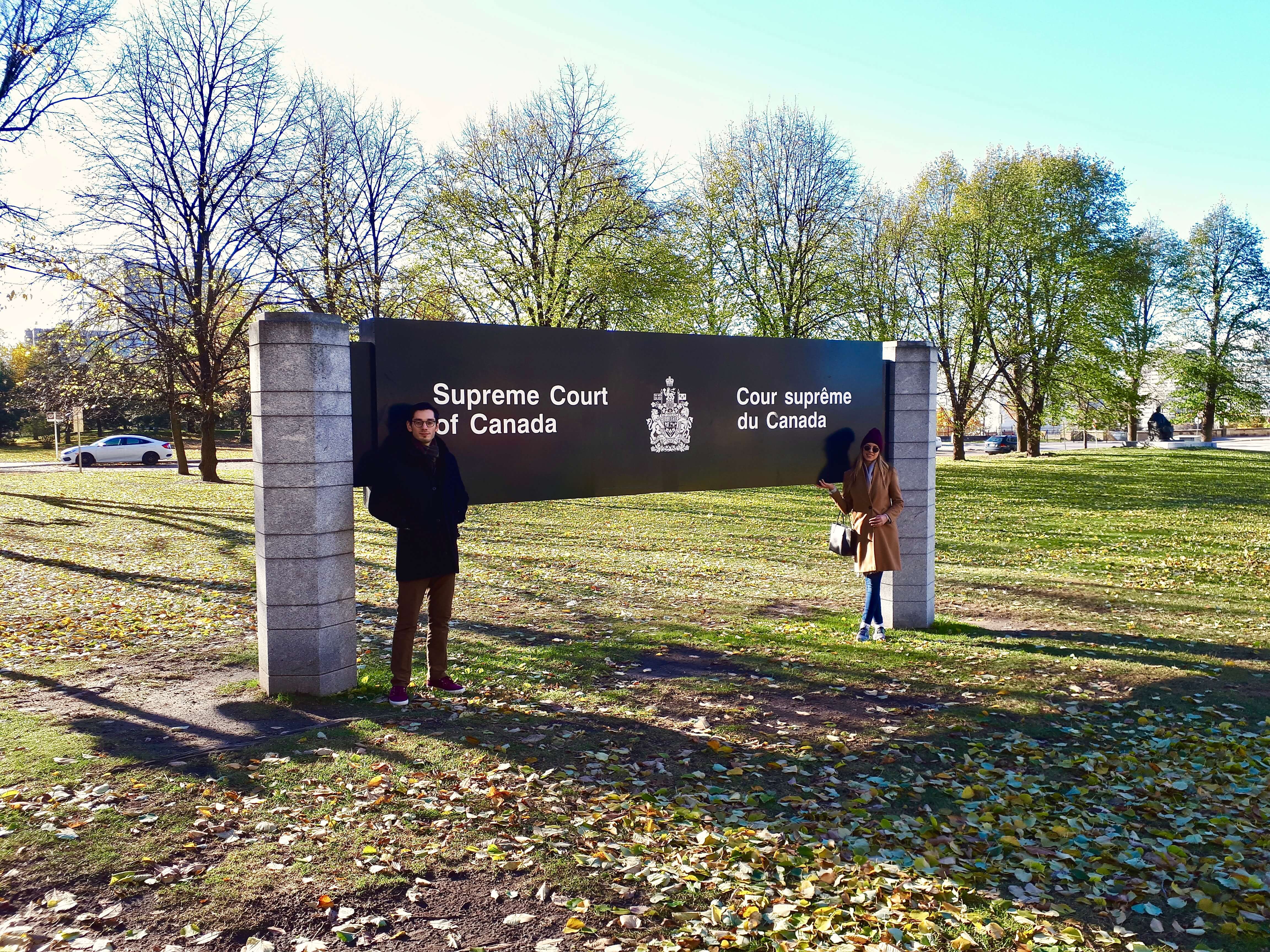 man and woman standing in from the Supreme Court of Canada 