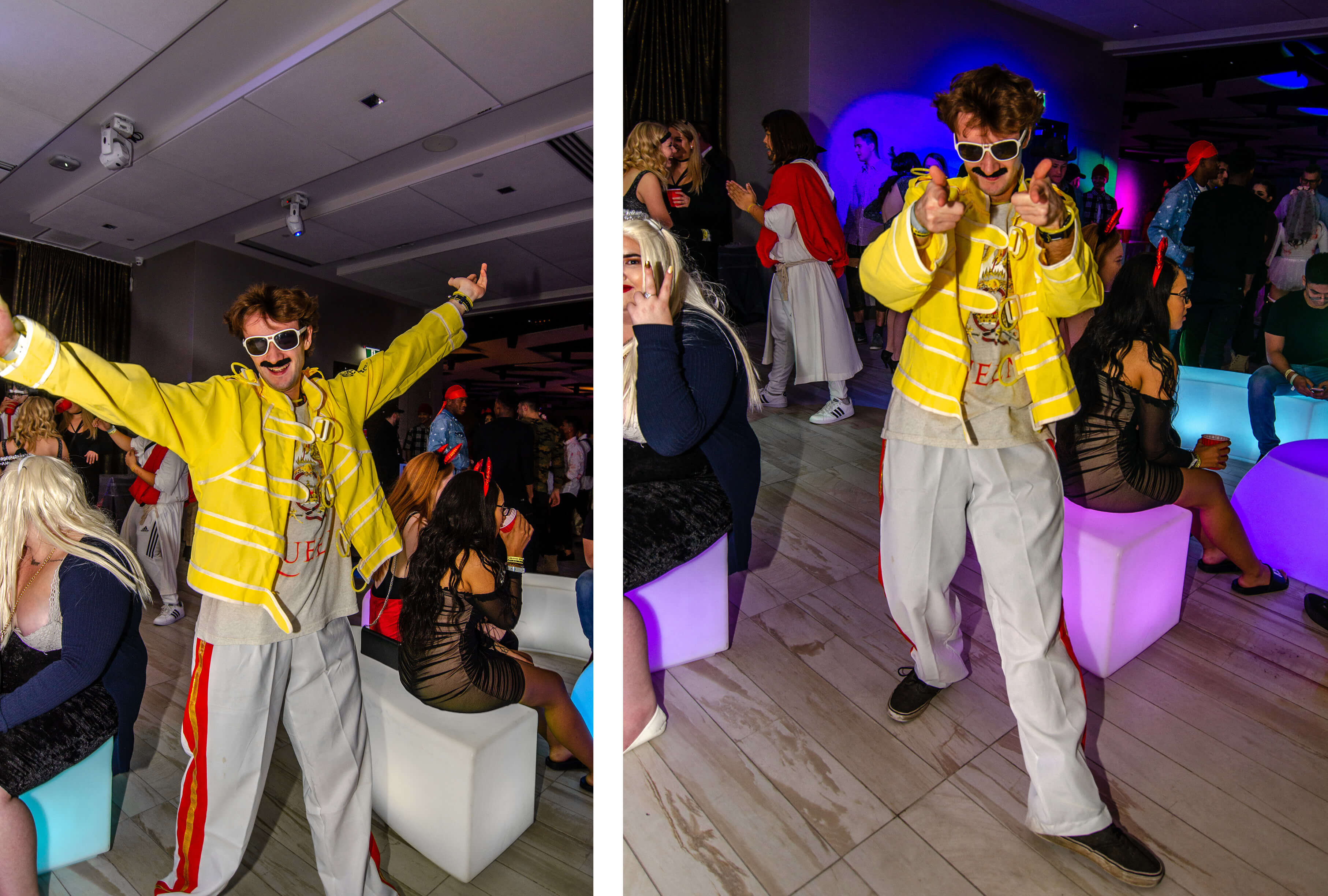 Student dressed as Freddy Mercury happily poses at the party