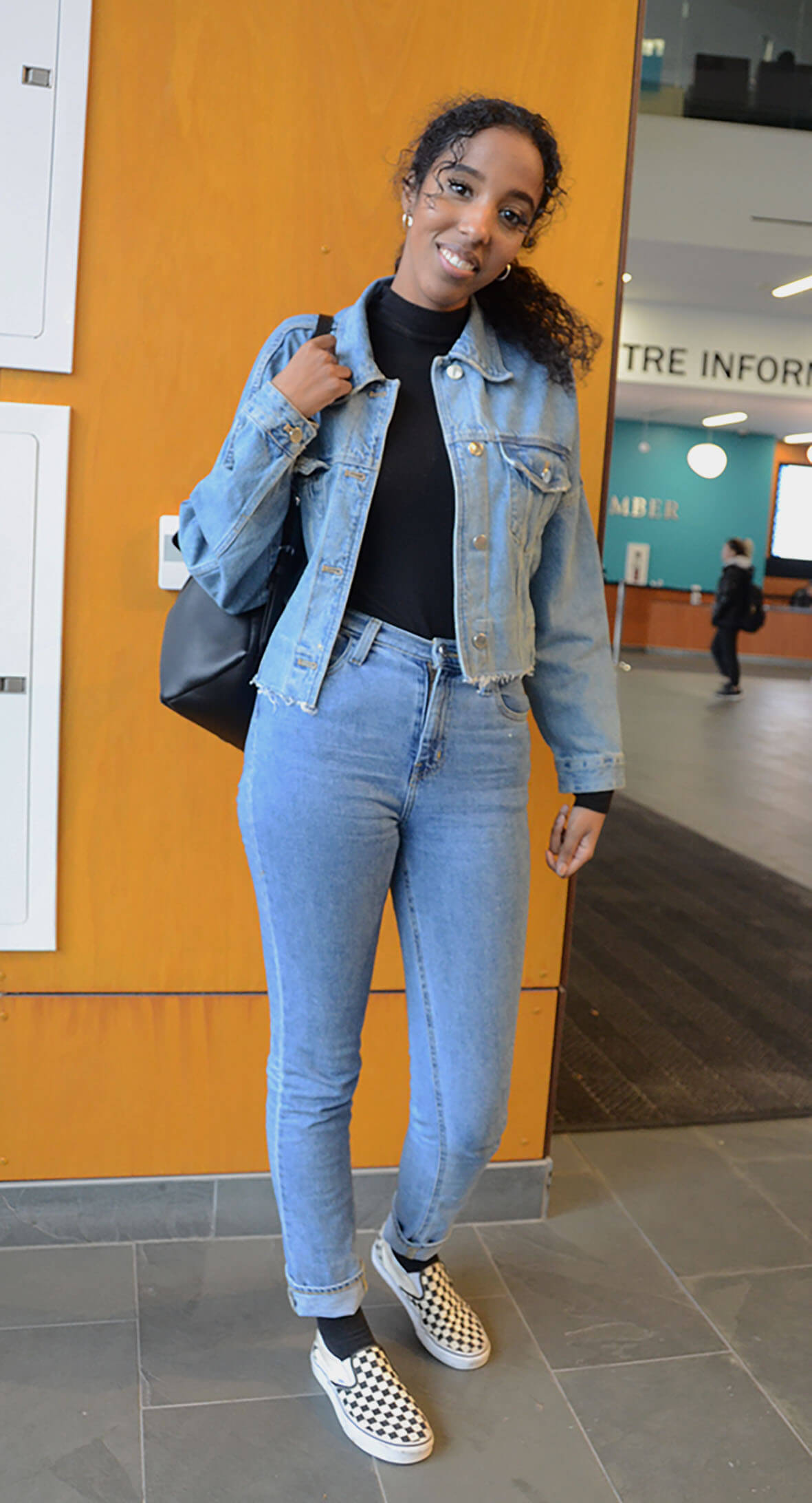 student poses for street styles