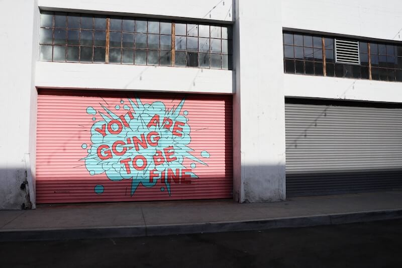 garage door reading "you are going to be fine"