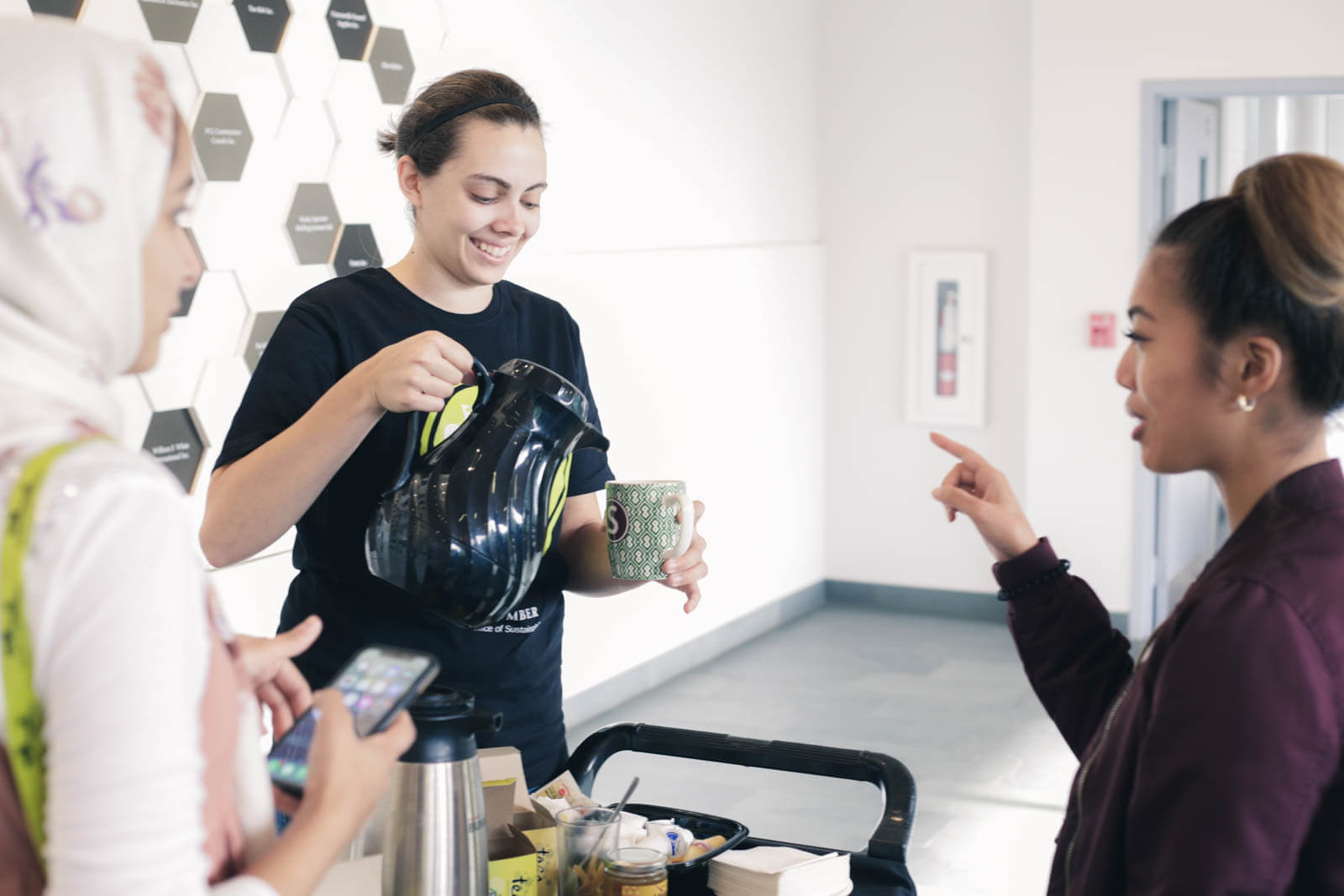 girl pouring fairtrade coffee