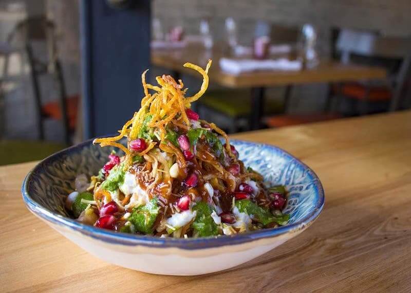 Colourful food dish including pomegranate