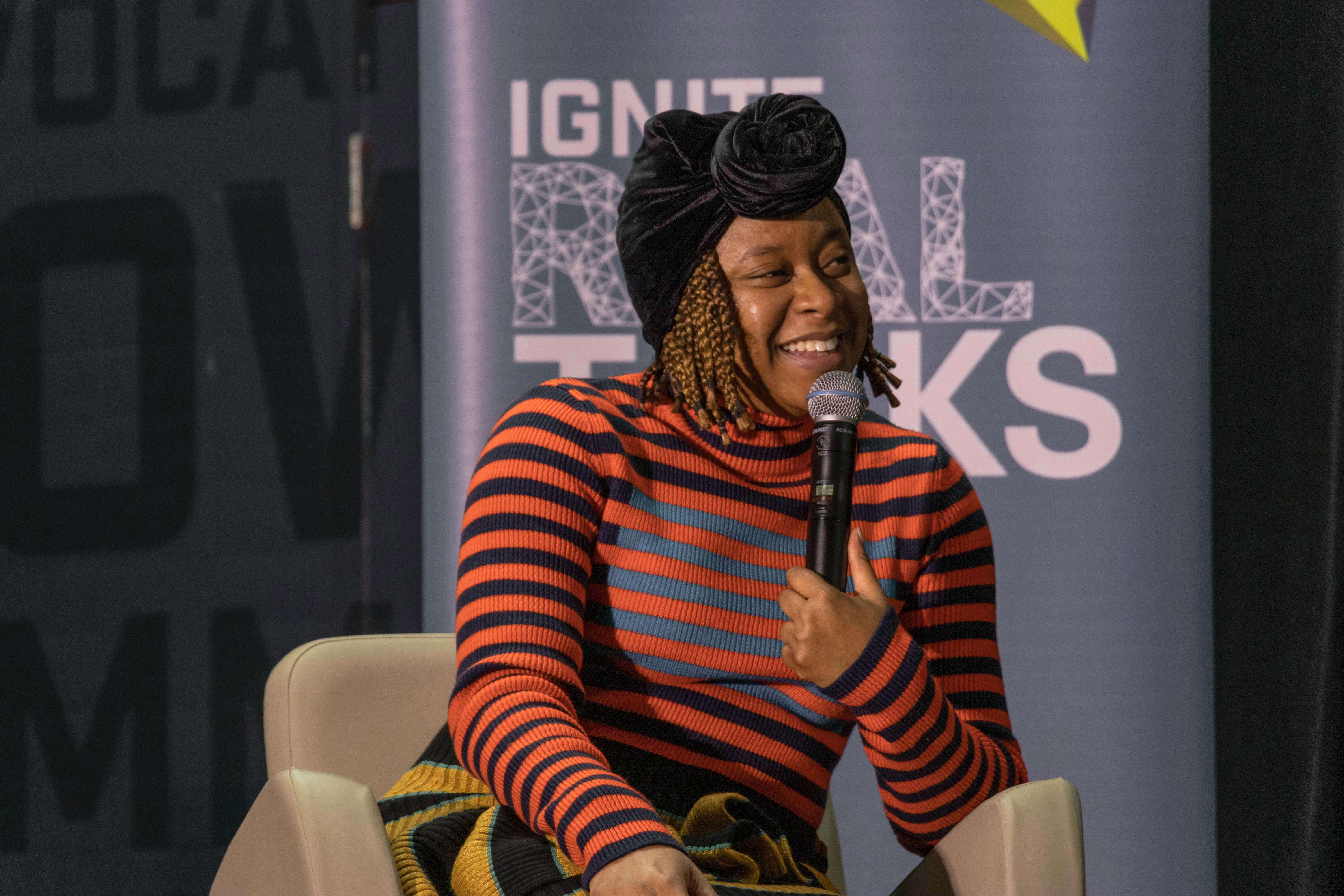Phoebe Robinson smiles onstage