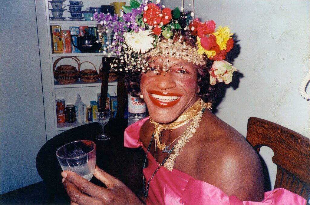 Photo of Marsha P Johnson wearing flowers