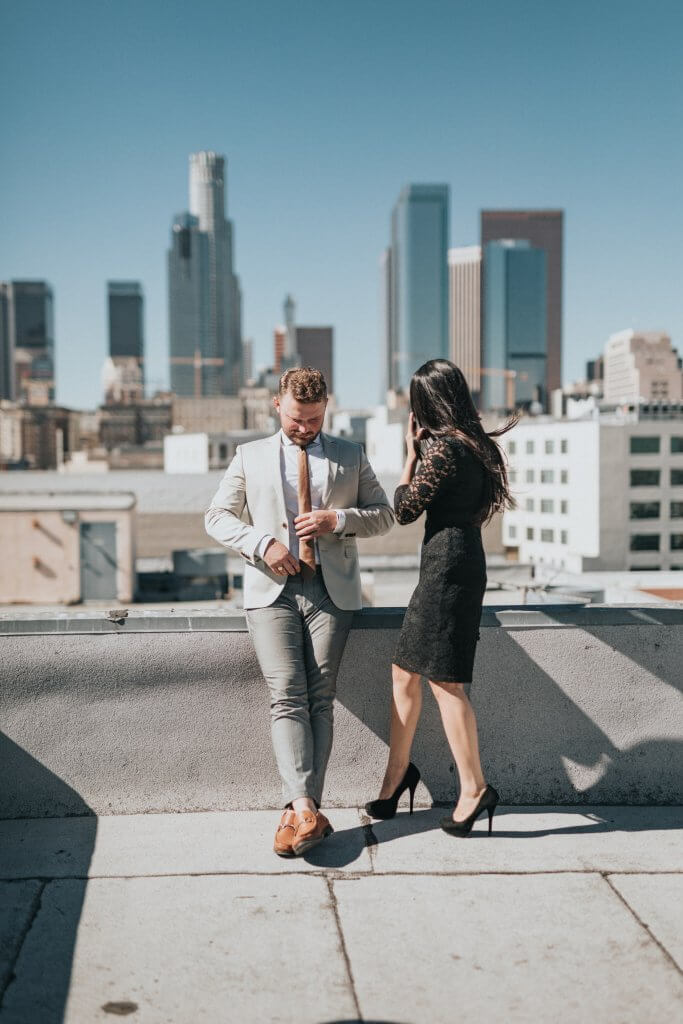 Man and woman on rooftop.