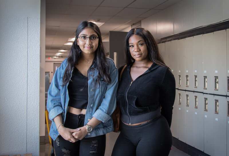 2 girls in front of lockers
