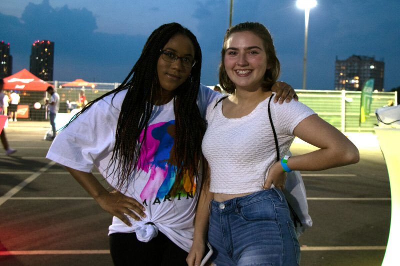 2 girls smiling in parking lot