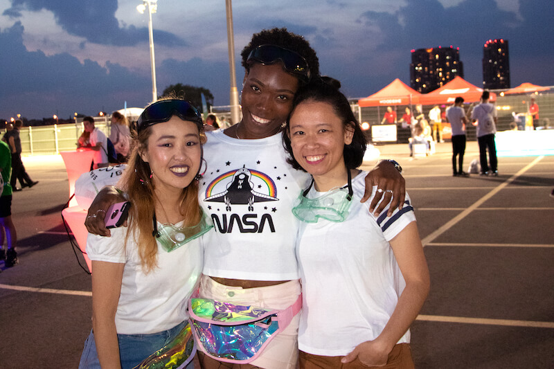 3 girls smiling in parking lot