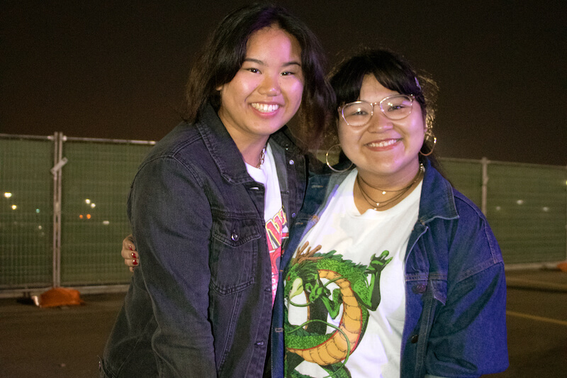 2 girls smiling in parking lot