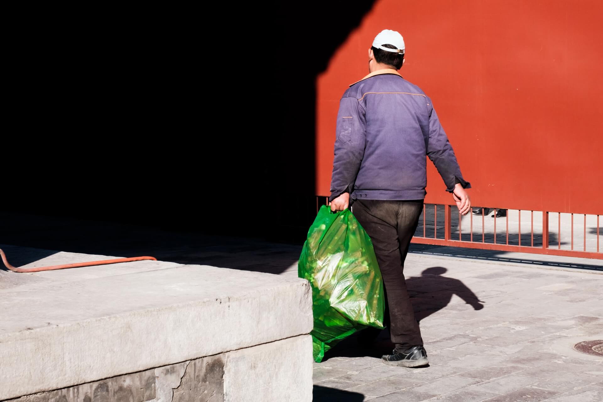 man cleaning up garbage