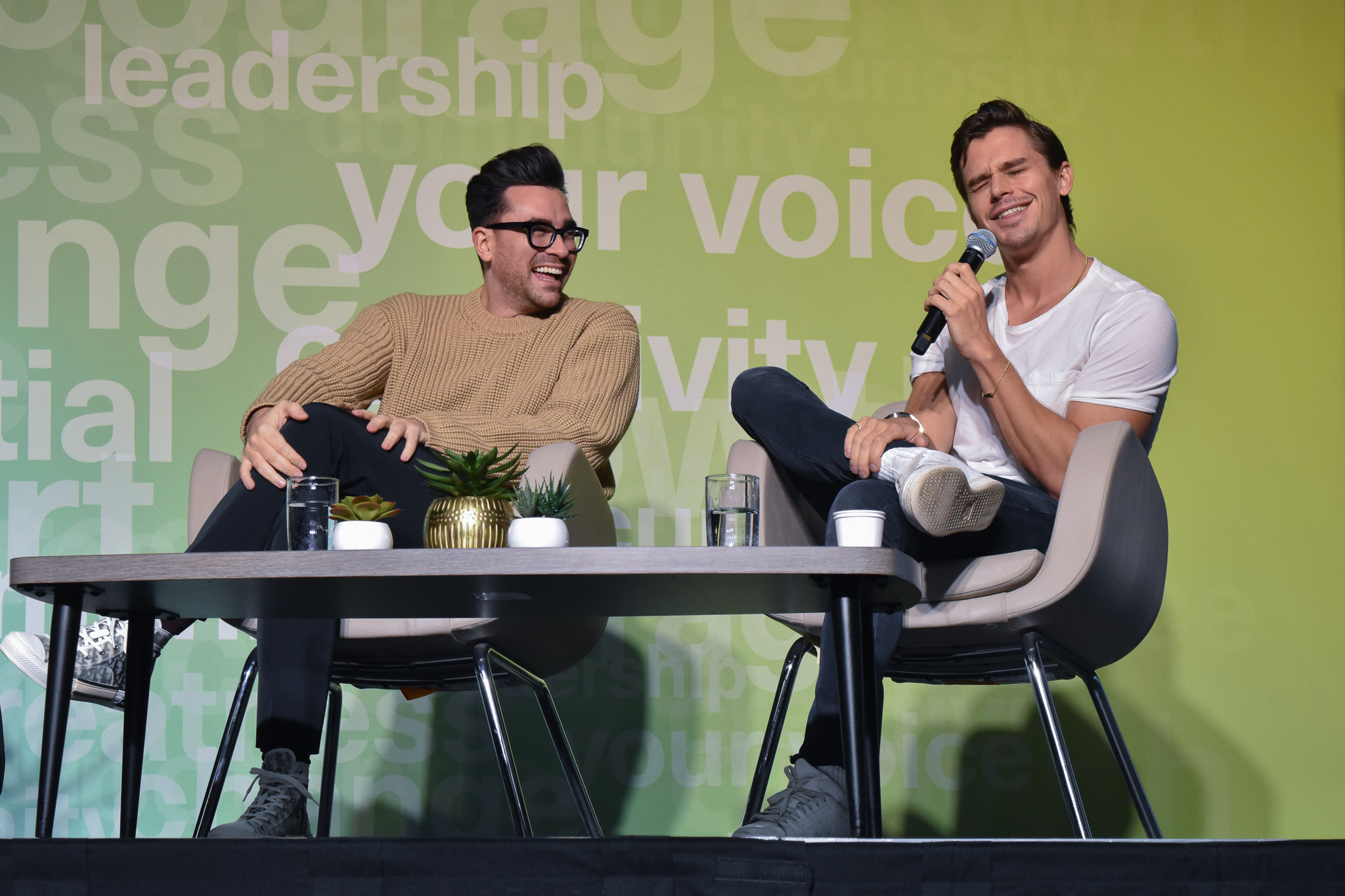 Dan Levy and Antoni Porowski on stage