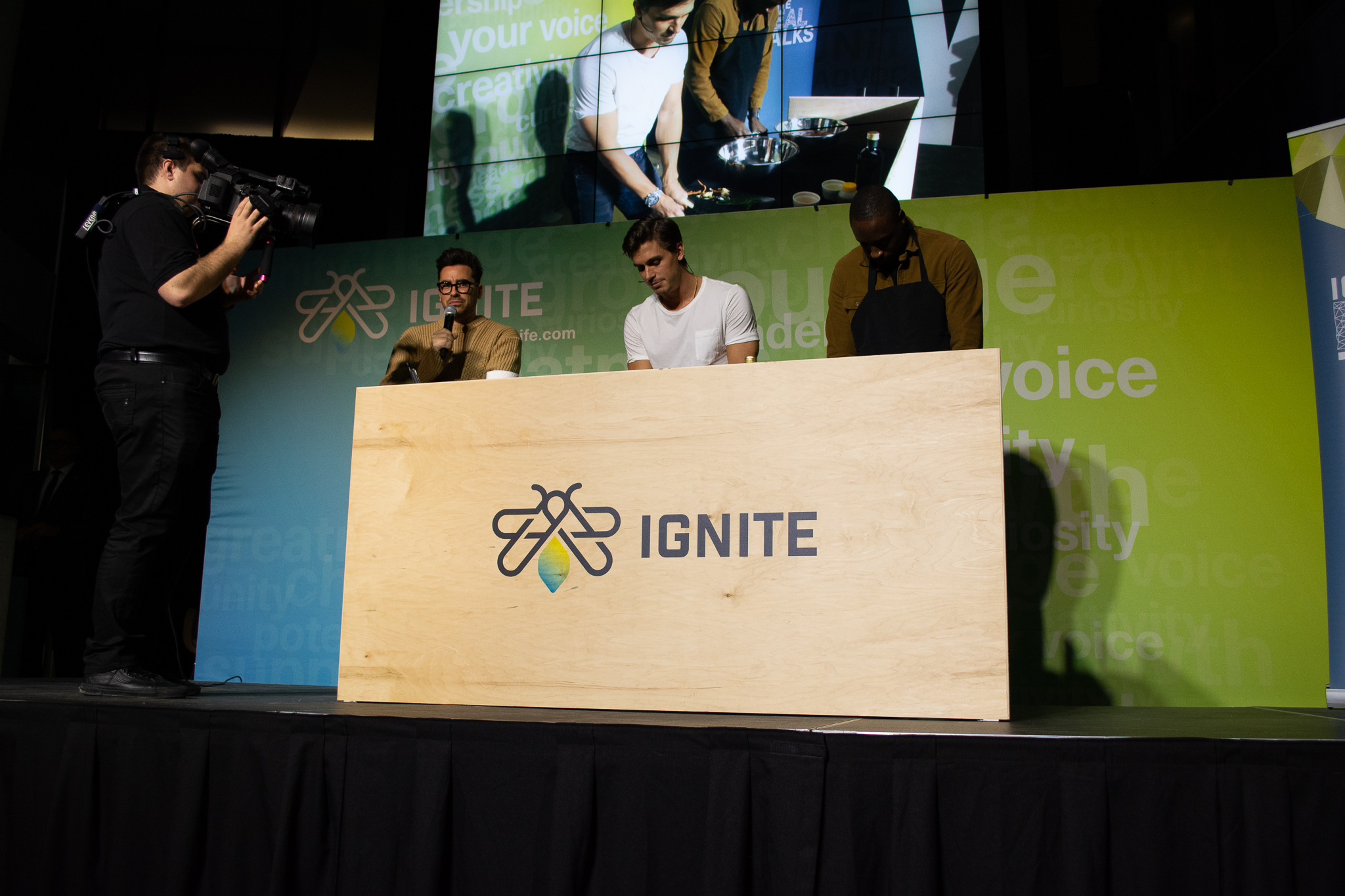 Antoni Porowski and Dan Levy cook on stage