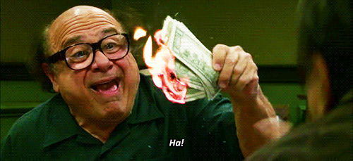 Danny Devito burning money 