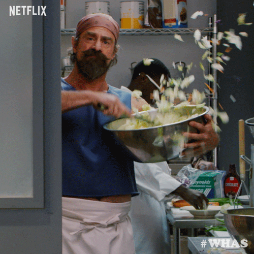 chef carelessly tossing salad