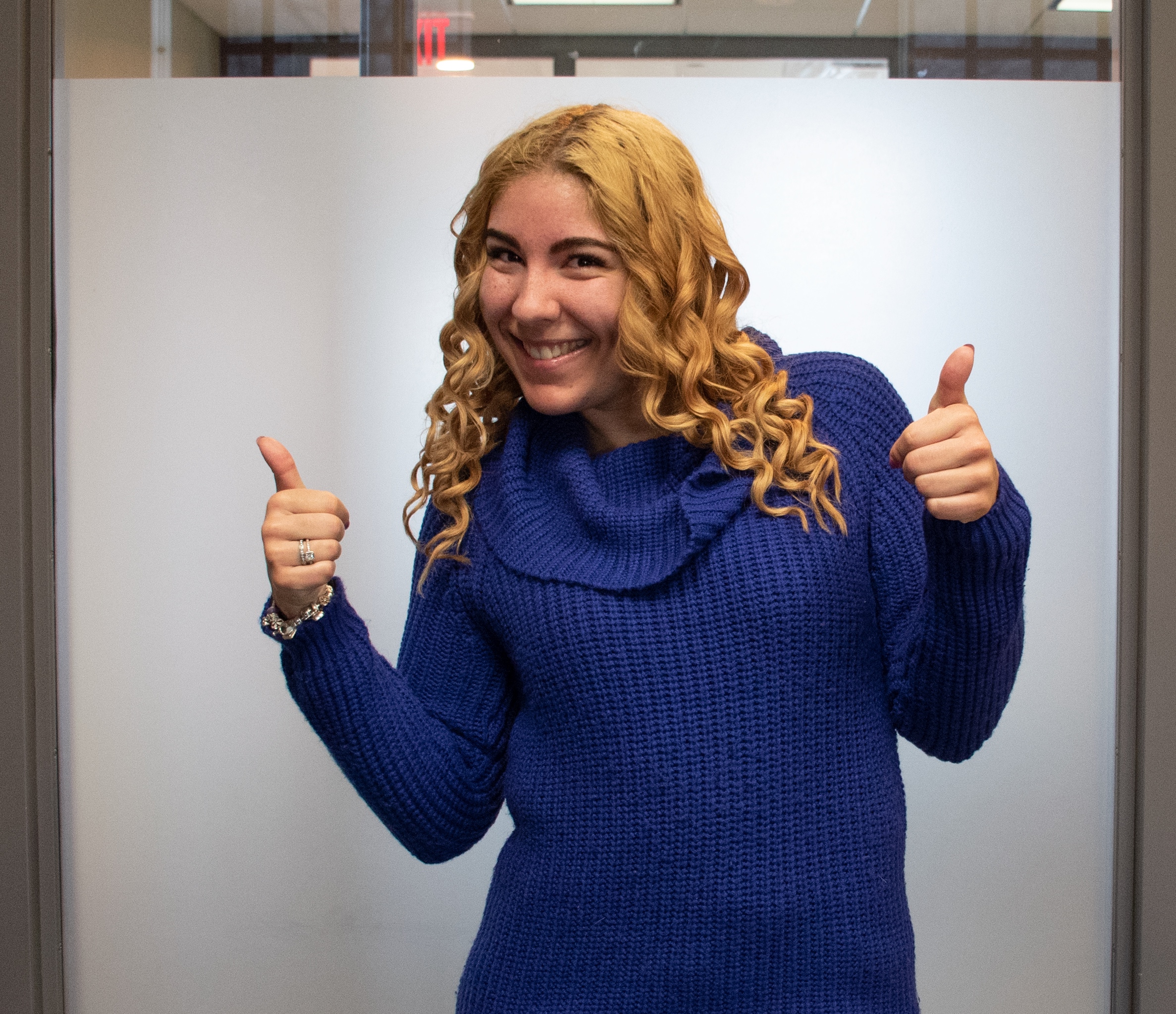 IGNITE Board of Directors member Stephanie Fallico smiles with her thumbs up