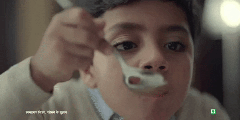 Gif of a young boy happily eating soup