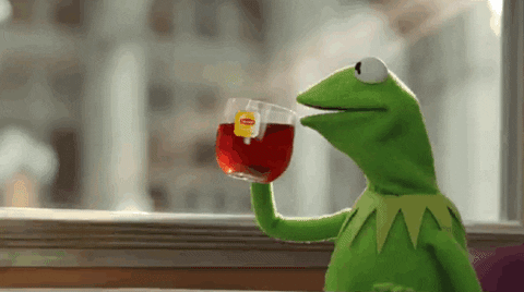 Kermit the Frog sips tea.