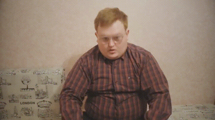 Gif of a man in a plaid shirt folding and bending a bill and then magically making it rain money.