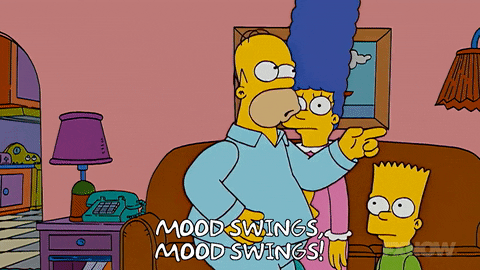 Homer Simpson from Matt Groening's "The Simpsons" wears blue pyjamas while dancing across his living room chanting "Mood swings," over and over.
