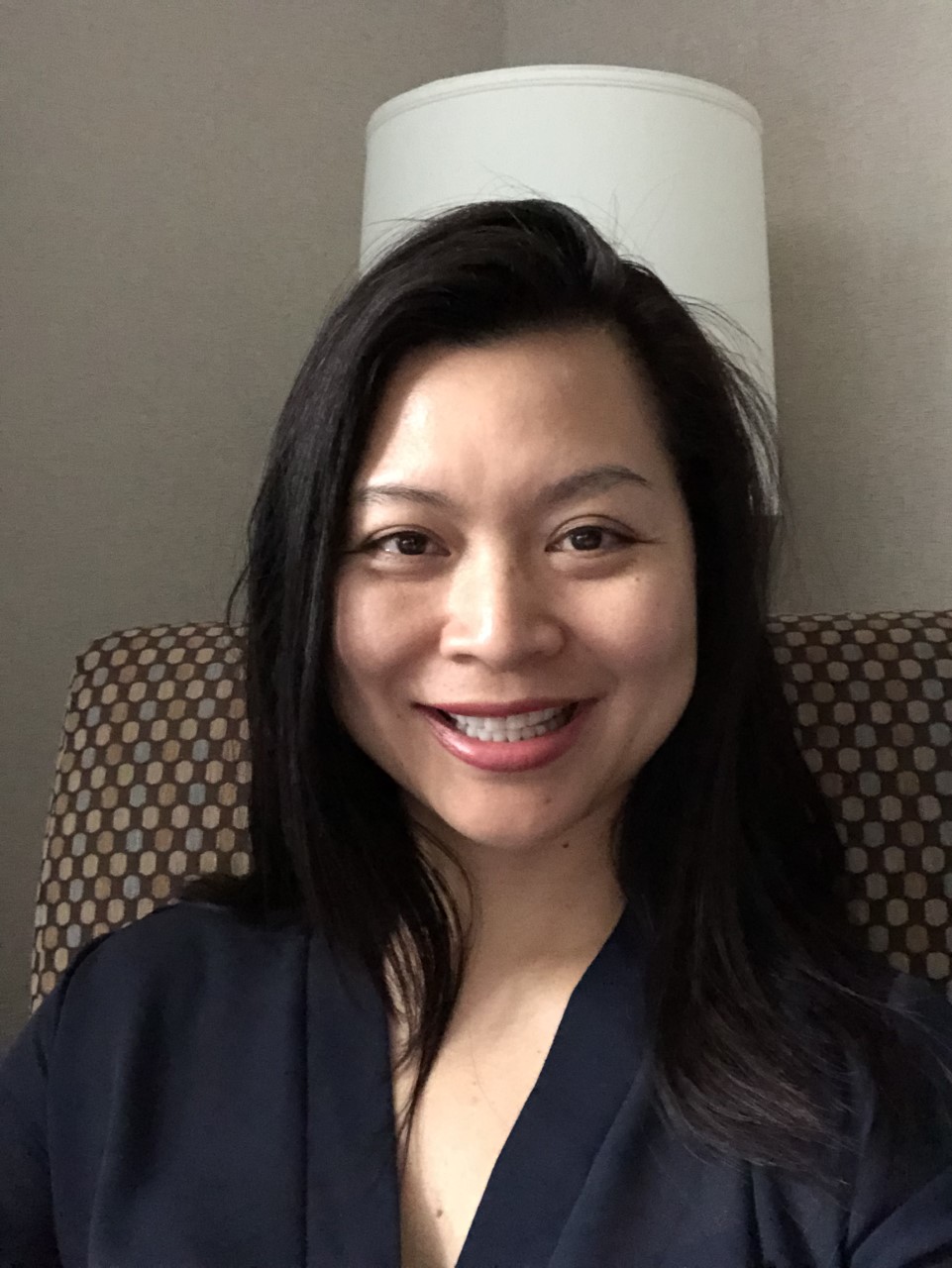 Sieu Moi Ly, director of student success at IGNITE, smiles at the camera.
