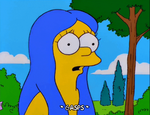 A woman with blue hair gasps.