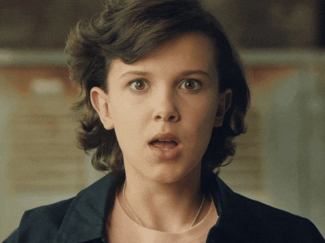 Millie Bobby Brown imitates an explosion.