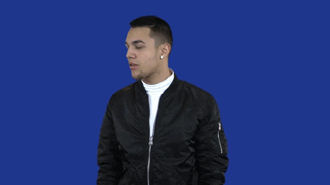 A man mimes drumming while the words, "Ba dum tss" appear on screen.